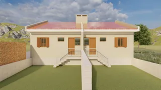 Fachada de uma residência com telhado vermelho e jardim em Lajeado.