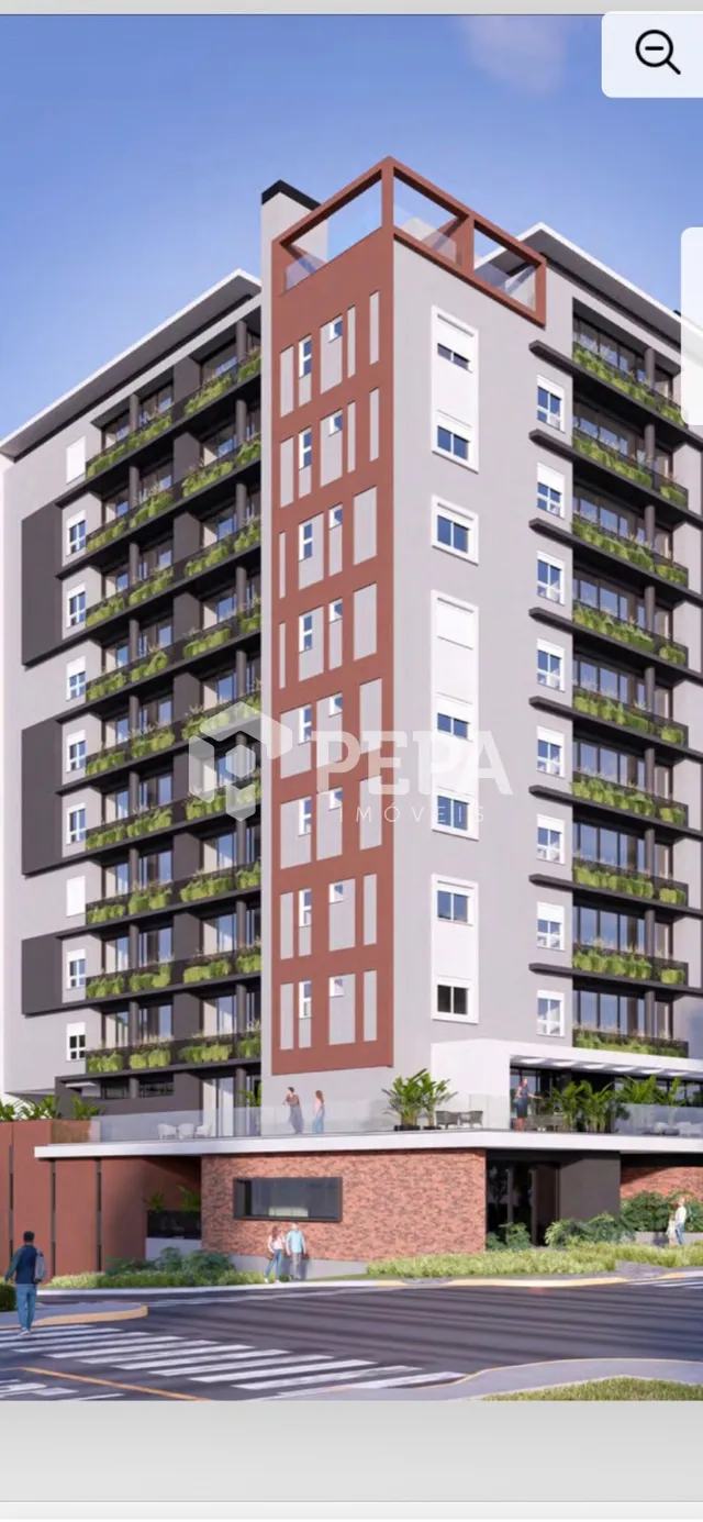Fachada de um prédio residencial moderno com detalhes em tijolo aparente em Lajeado, Brasil.