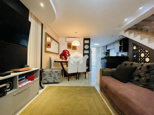 Sala de estar e jantar de uma residência moderna em Lajeado.