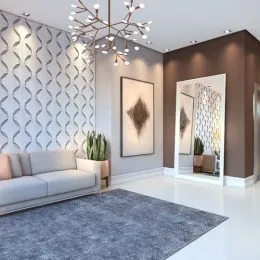 Uma sala de estar moderna com sofá claro e iluminação elegante.
