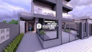 Fachada de um prédio residencial moderno em Lajeado, Brasil, com muro e portão de segurança.