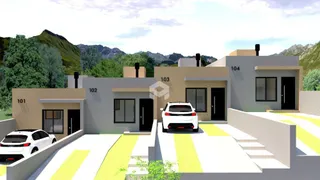 Fachada de uma residência em Lajeado, Brasil, apresentando três unidades numeradas.