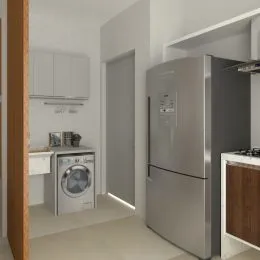 Foto interna mostrando armários e uma geladeira em um ambiente residencial.
