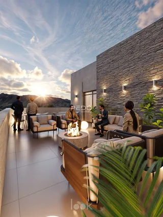 Área de lazer externa moderna com lareira e vista para as montanhas.