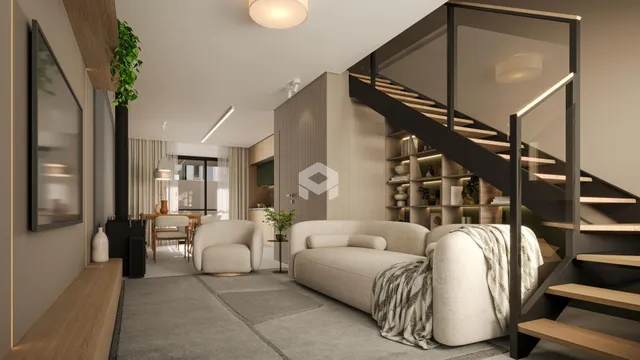Sala de estar moderna com sofá e escadaria de madeira.