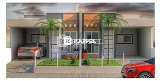 Fachada moderna de uma casa residencial em Lajeado, Brasil, com paisagismo frontal.