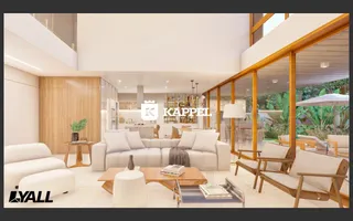 Sala de estar moderna com sofá branco e vista para o jardim externo.