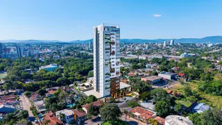 Vista aérea de um edifício residencial em Lajeado, Brasil, cercado por vegetação.