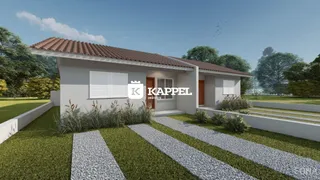 Fachada de uma casa residencial em Lajeado, Brasil, com telhado de telhas e paisagismo frontal.