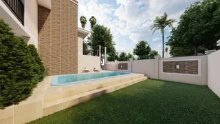 Vista externa de uma piscina e jardim em uma propriedade.