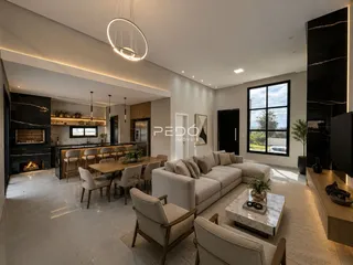 Sala de estar moderna com lareira e grandes janelas.