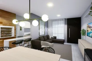 Sala de estar com sofá e luminária pendente em ambiente interno.