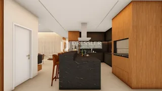Vista de um ambiente interno moderno com cozinha e ilha em Lajeado.