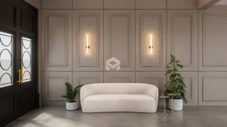 Sala de estar com paredes em painel e porta de madeira escura.