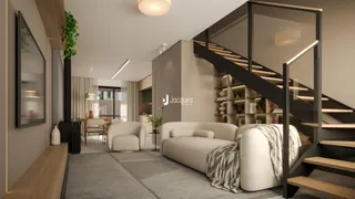 Sala de estar moderna com escadaria e decoração clara.