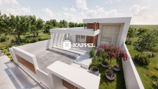 Fachada de uma casa moderna com área externa e jardim em Lajeado, Brasil.