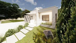Fachada moderna de uma casa em Lajeado com jardim bem cuidado.