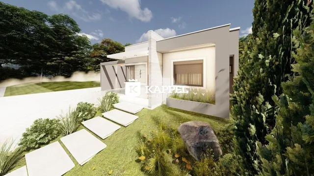 Fachada moderna de uma casa em Lajeado com jardim bem cuidado.