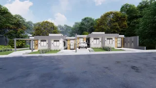 Fachada moderna de uma residência em Lajeado, Brasil, cercada por vegetação.