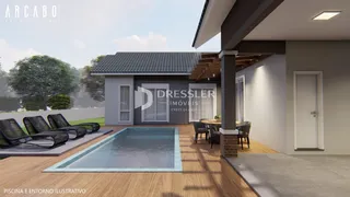 Vista externa de uma casa com piscina e área de lazer em Lajeado.