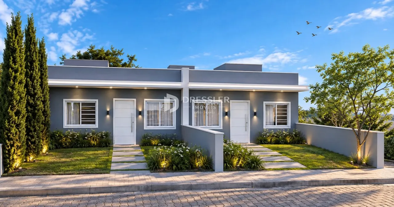 Fachada moderna de uma residência em Lajeado, Brasil, com jardim frontal bem cuidado.
