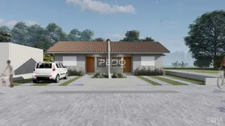 Fachada de uma residência em Lajeado, Brasil, com jardim e entrada pavimentada.