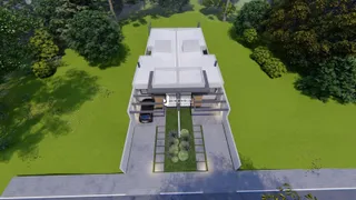 Fachada de uma casa moderna em Lajeado, Brasil, com jardim ao redor.