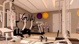 Imagem de uma área interna com equipamentos de ginástica.