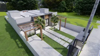 Fachada moderna de uma residência com jardim e área externa em Lajeado.