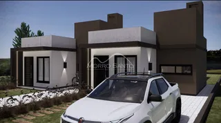 Fachada moderna de uma residência em Lajeado, Brasil, com paisagismo frontal.
