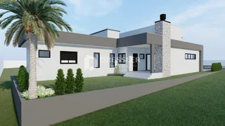 Fachada de uma casa moderna com chaminé de pedra em Lajeado.