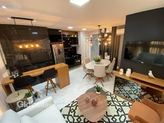 Sala de estar e jantar de um apartamento moderno em Lajeado.