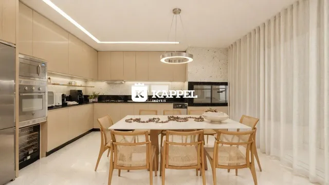 Foto de uma sala de jantar com mesa de madeira e armários claros em um imóvel.