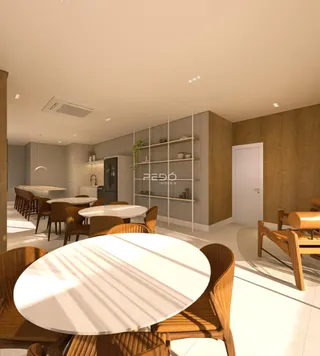 Sala de jantar com mesas de madeira e decoração moderna em um imóvel.