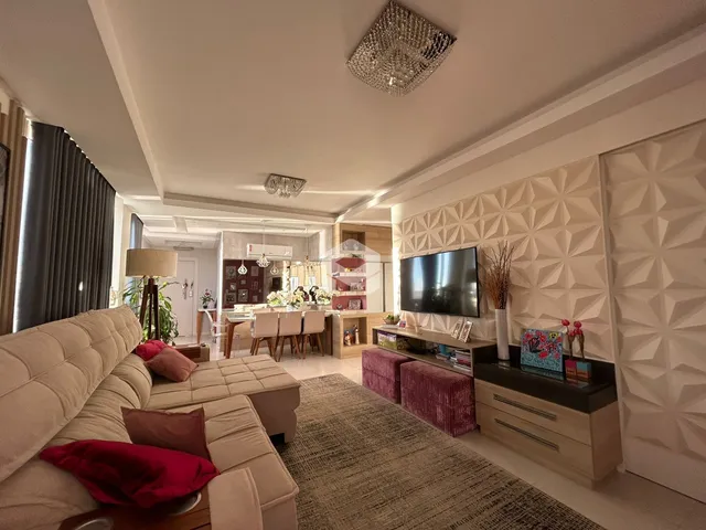 Sala de estar moderna com sofá e decoração contemporânea.