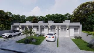 Fachada moderna de uma residência em Lajeado, Brasil, com jardim e área de garagem.