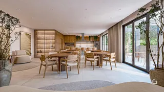 Ambiente de jantar moderno com grandes janelas que dão vista para o exterior.