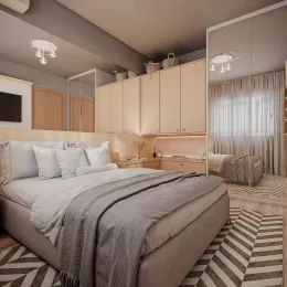 Quarto com cama e armários de madeira em um apartamento.