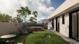 Vista externa de uma residência com jardim e área de lazer.