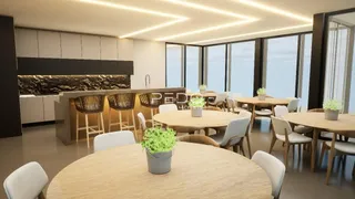 Imagem de um ambiente interno moderno com mesa de jantar e cozinha aberta.