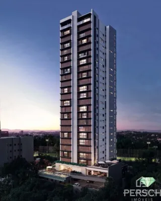 Fachada de um prédio residencial alto em Lajeado, Brasil, ao pôr do sol.