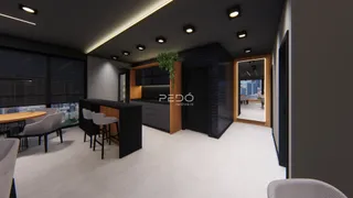 Vista de um ambiente moderno com cozinha e área de jantar em um imóvel.