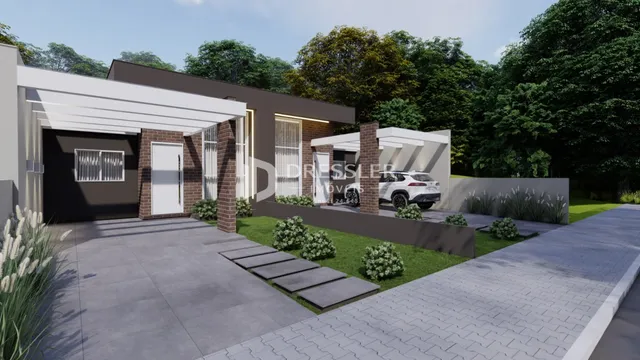 Fachada moderna de uma residência com garagem e jardim em Lajeado.