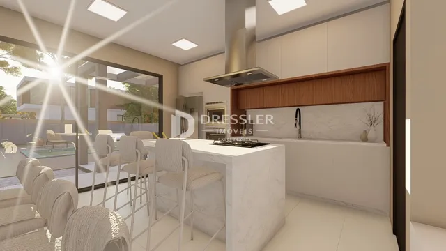 Vista de uma cozinha moderna com ilha e acesso a área externa.