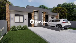 Fachada moderna de uma residência em Lajeado, Brasil, com jardim e garagem.