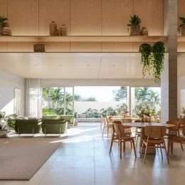 Foto de uma sala de estar com grandes janelas que dão para a área externa.