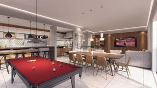 Sala de estar com mesa de bilhar e cozinha integrada em um ambiente moderno.