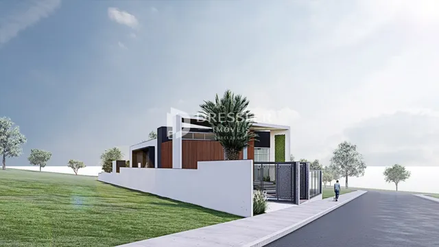 Fachada moderna de uma casa em Lajeado, Brasil, com jardim gramado.