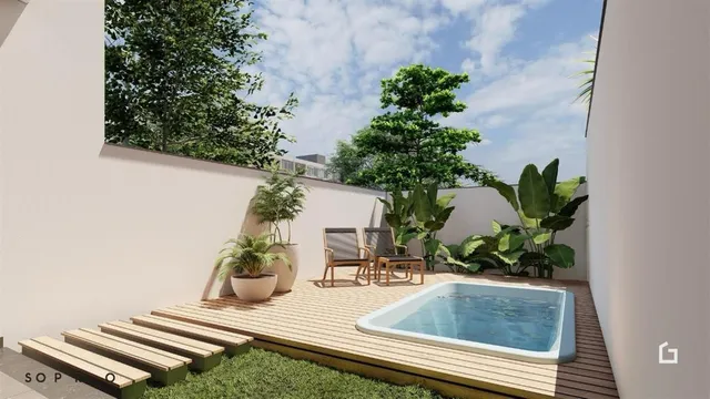 Vista de uma piscina e deck ao ar livre em uma propriedade.