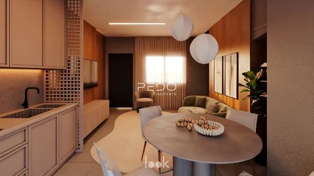 Sala de estar com móveis modernos e iluminação clara.